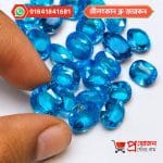 Collection of faceted Blue Zircon gemstones in different shapes and sizes