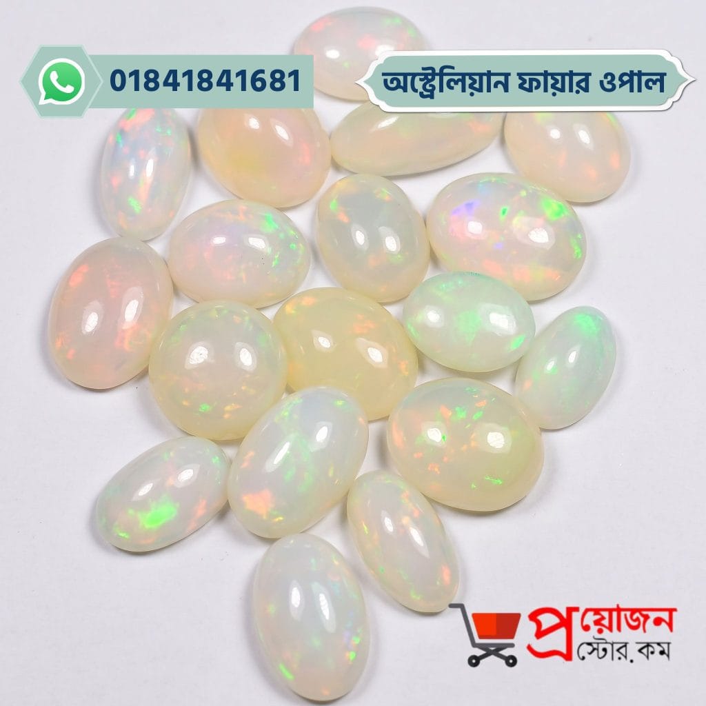 Bulk lot of loose polished oval white natural Australian Fire Opal gemstones with multi-color rainbow fire play on a white background by Proyojonstore