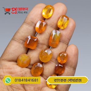 Multiple faceted oval, rectangle, and cushion cut golden-yellow Bangkok Yellow Sapphire gemstones displayed on an open hand by Proyojonstore