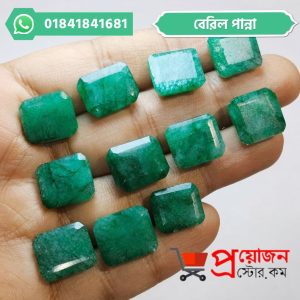Array of faceted rectangular and octagon cut natural green Beryl Emerald gemstones placed along fingers by Proyojonstore