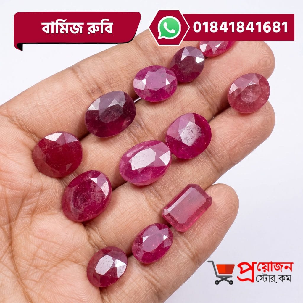Multiple faceted oval and rectangle cut pinkish-red Burma Ruby gemstones displayed on an open hand by Proyojonstore