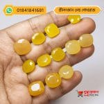Multiple faceted oval and cushion cut natural yellow Srilankan Old Yellow Sapphire gemstones displayed on an open hand by Proyojonstore