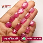 Array of faceted oval and rectangle cut natural pink-red Old Burma Ruby gemstones placed along fingers by Proyojonstore