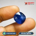 Close-up of Bangkok Blue Sapphire gemstone with blue faceted surface