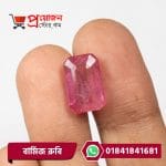 Fingertips holding a faceted rectangular octagon step-cut natural pinkish-red Burma Ruby gemstone by Proyojonstore