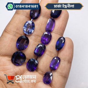Collection of natural oval cut Marca Blue Sapphire gemstones displayed on palm - Proyojonstore