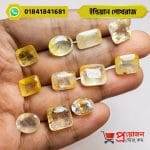 Hand-held display of multiple faceted oval, cushion, and rectangle cut natural Indian Yellow Sapphire gemstones by Proyojonstore