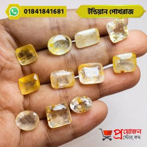 Hand-held display of multiple faceted oval, cushion, and rectangle cut natural Indian Yellow Sapphire gemstones by Proyojonstore