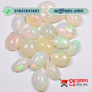 Group lot of loose polished white Australian Fire Opal gemstone cabochons arranged on a white background by Proyojonstore