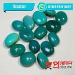 Bulk lot of loose polished oval and round sea-green natural Feroza Turquoise gemstone cabochons on a white background by Proyojonstore