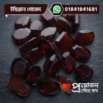Bulk lot of loose faceted oval, cushion, and rectangular natural Indian Gomed gemstones on a dark background by Proyojonstore