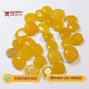 Bulk lot of loose faceted oval and cushion cut butter-yellow Srilankan Old Yellow Sapphire gemstones on a white background by Proyojonstore