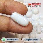 Fingertips holding a smooth elongated capsule-cut white natural Australian Opal gemstone by Proyojonstore