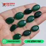 Multiple faceted oval cut vibrant green natural Old Brazil Emerald gemstones displayed across an open hand by Proyojonstore