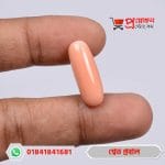 Finger holding a smooth cylindrical/capsule shaped natural Italian coral gemstone by Proyojonstore