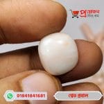 Cushion-cut square shaped Italian White Coral gemstone held on fingers by Proyojonstore