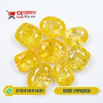 Symmetrical display of loose faceted oval, cushion, and rectangular bright yellow Marka Yellow Sapphire gemstones on a white background by Proyojonstore
