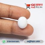 Close-up of a smooth symmetrical oval milky white natural Australian Opal gemstone held between fingers by Proyojonstore