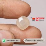 Close-up of a sparkling square-cushion faceted natural Srilankan White Sapphire gemstone held between fingers by Proyojonstore